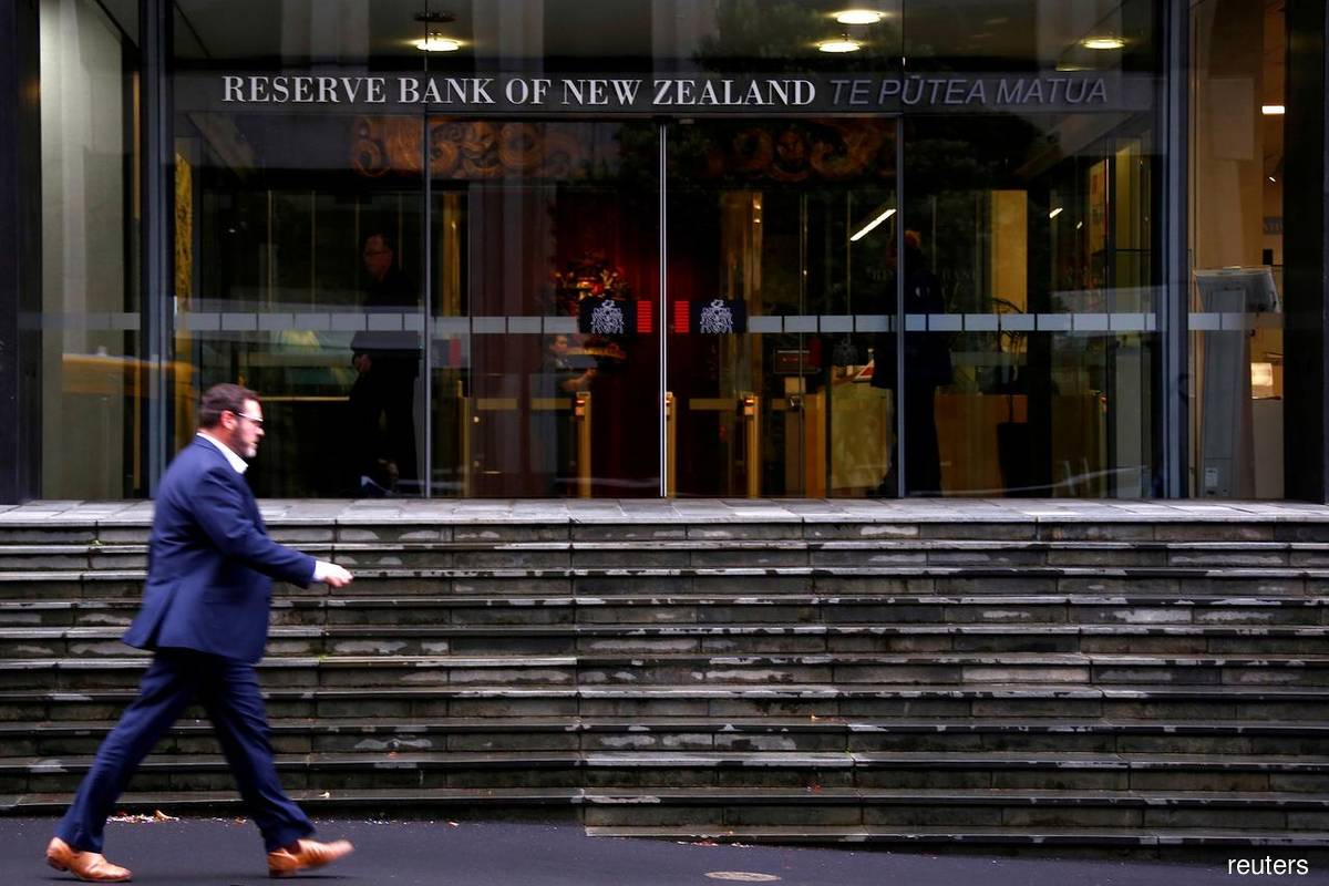 New Zealand raises key interest rate by half-point, sees further tightening